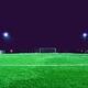 A brightly lit soccer field at night in Norrtälje, Sweden, showcasing green turf and stadium lights.